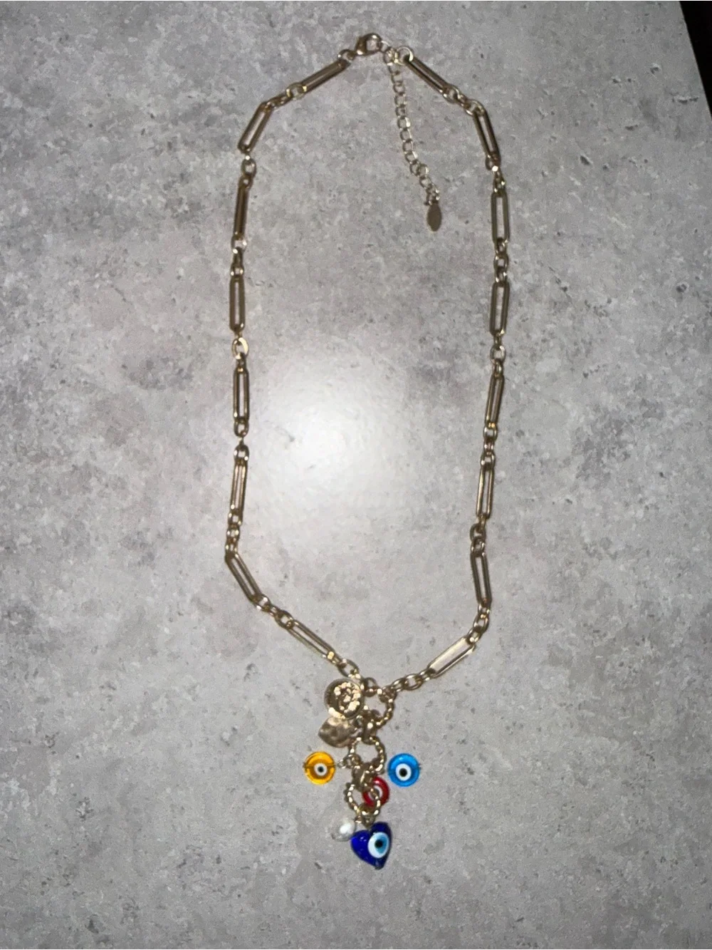 REVOLVE Gold Charm Necklace with Blue, Yellow, Red and White Evil Eye Accents